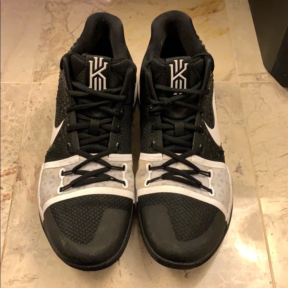 “Kyrie Irving 3” black and white basketball shoe.